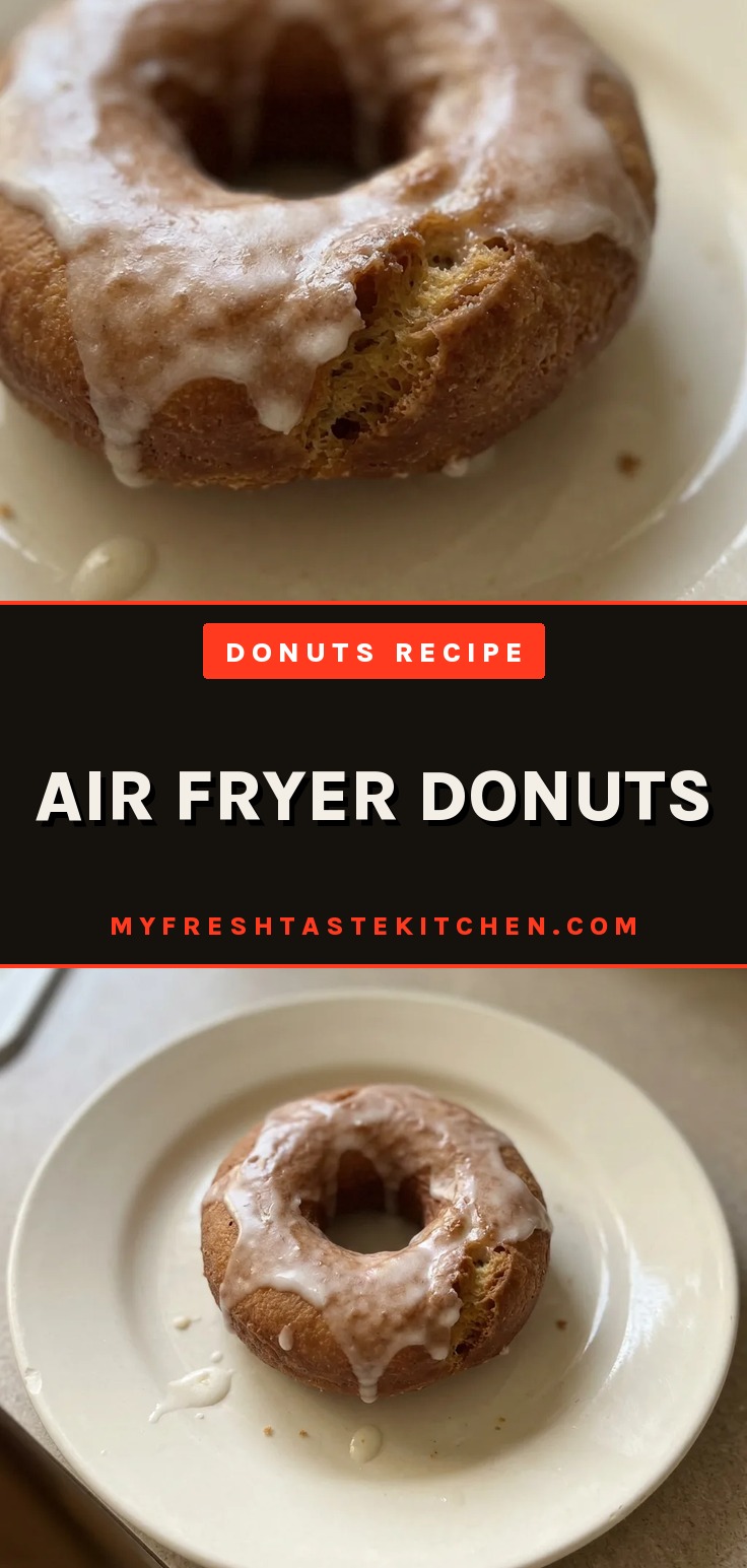 Air fryer donuts dusted with powdered sugar and cinnamon, showing a golden brown exterior and fluffy interior.
