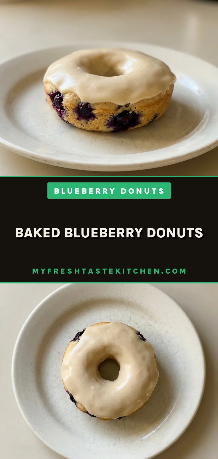 Baked blueberry donuts with maple syrup and coconut oil, topped with a lemon glaze, on a wire rack.