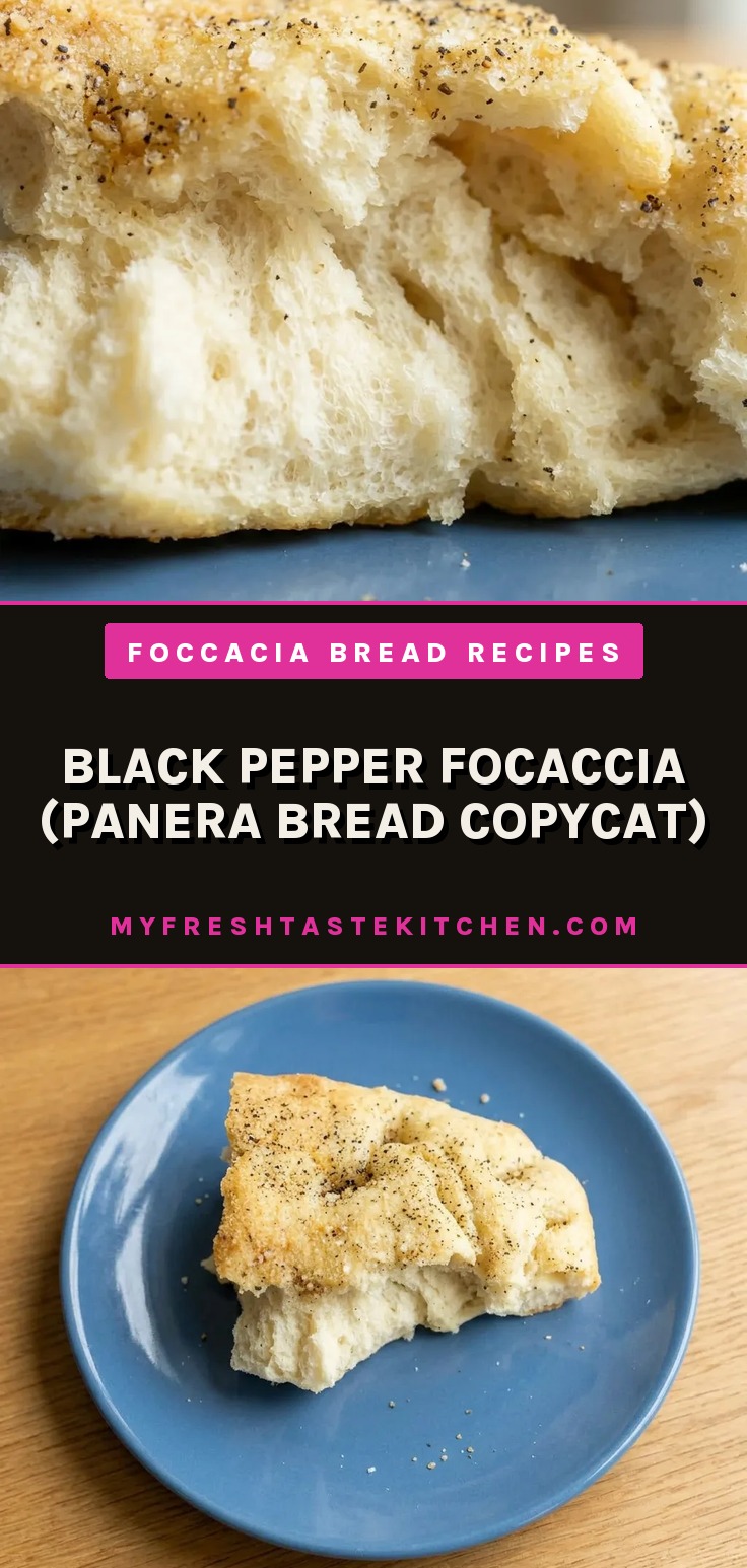 Looking down at a square of golden-brown focaccia topped with black pepper and grated Parmesan cheese.