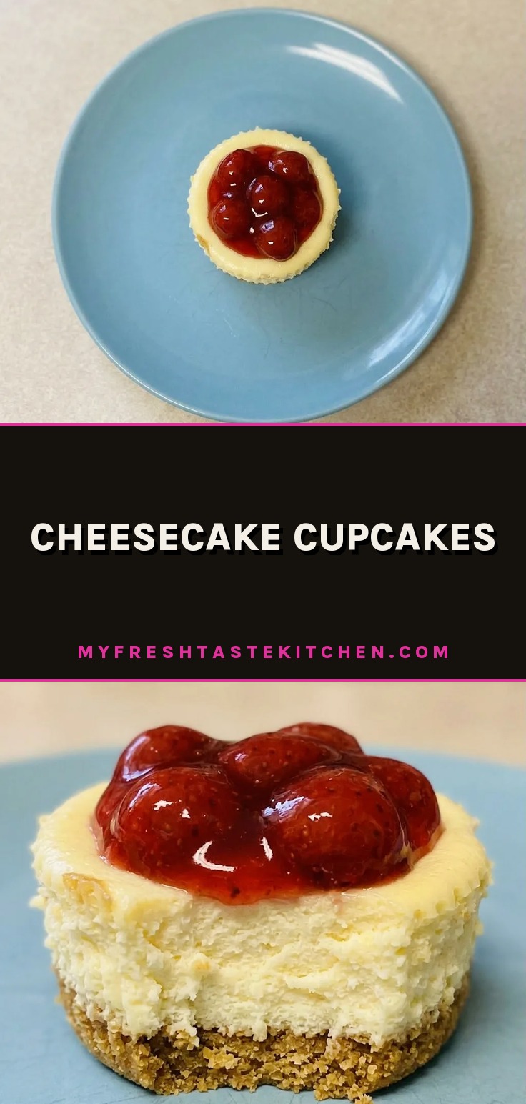 Looking down at three cheesecake cupcakes topped with strawberry slices and graham cracker crumbs.