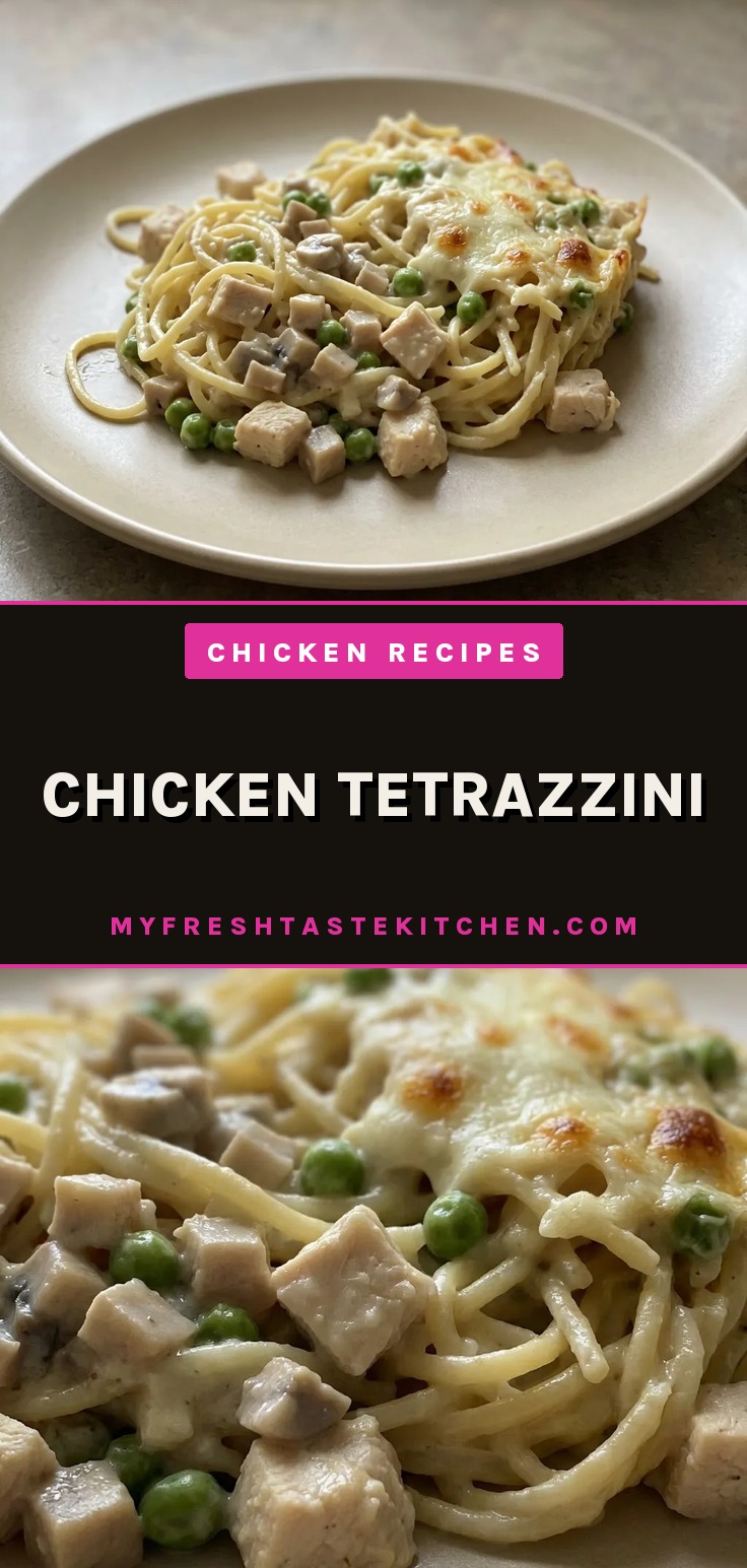 Looking down at a creamy chicken tetrazzini with spaghetti, mushrooms, peas, and melted mozzarella and parmesan cheese.