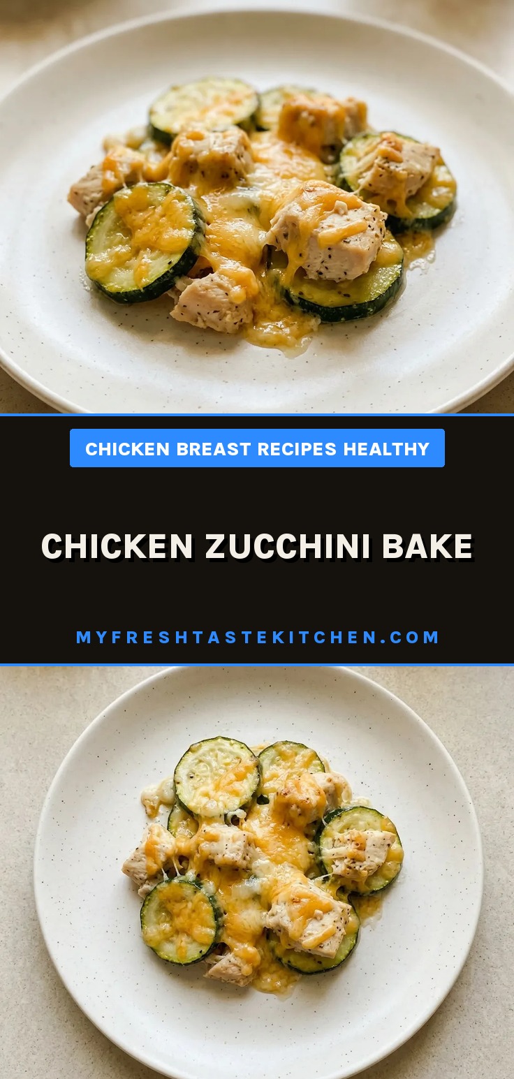 Top-down look at chicken pieces and zucchini slices arranged in a single layer, topped with melted cheddar cheese.