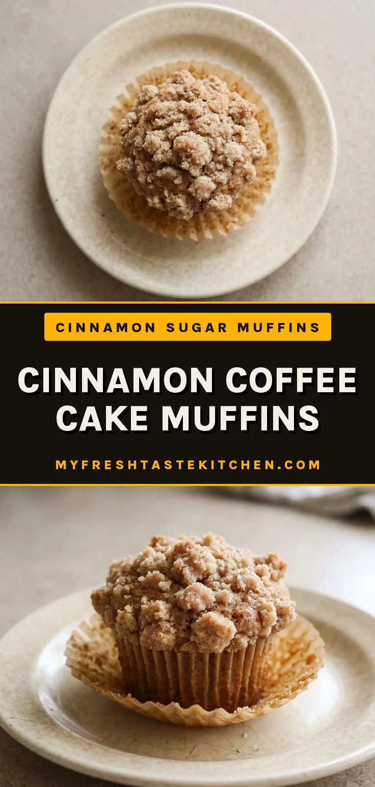 Top-down look at a round muffin with a cinnamon swirl pattern on top, visible brown sugar crumble.