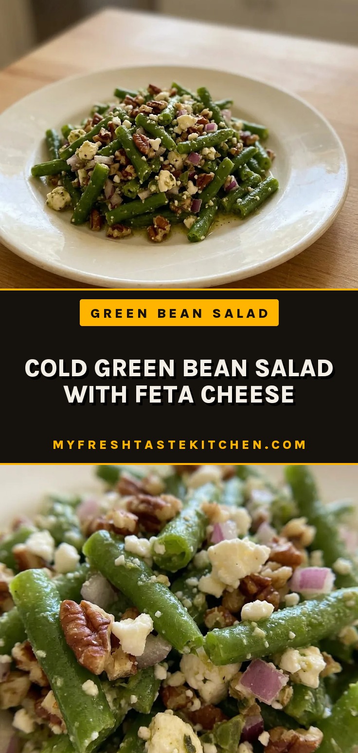 Cold green bean salad with feta cheese, pecans, and red onion in a bowl.