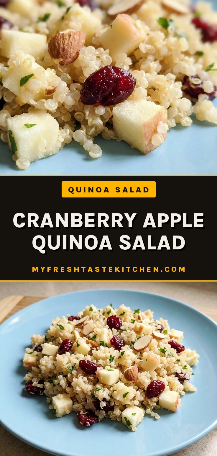 Bird's-eye view of quinoa mixed with diced apple, dried cranberries, parsley, and sliced almonds in a white bowl.