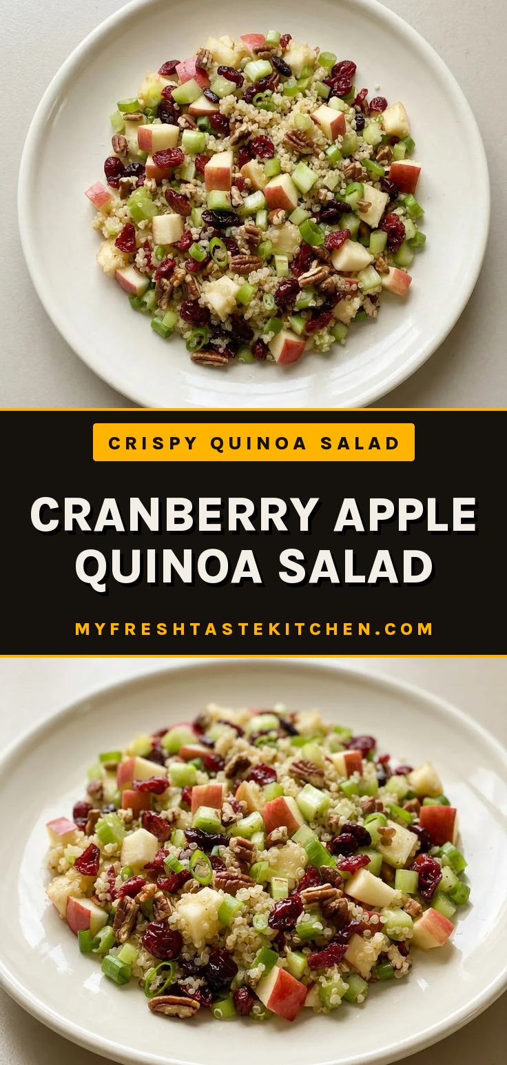 Top-down look at a bowl of quinoa mixed with diced apple, dried cranberries, celery, green onions, and pecans.