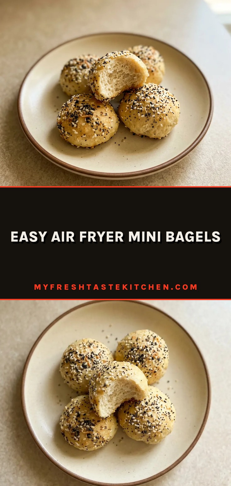 Easy air fryer mini bagels are small golden rounds coated in everything bagel seasoning, with a few sesame and poppy seeds visible on the surface.