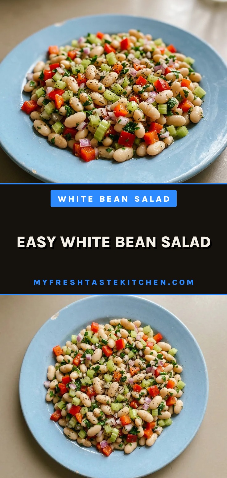 Easy white bean salad with white beans, red bell pepper, celery, red onion, and parsley in a bowl.