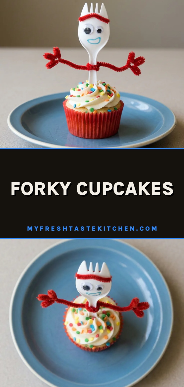 Overhead shot of a white frosted cupcake with rainbow sequin sprinkles and a Forky decoration on top.
