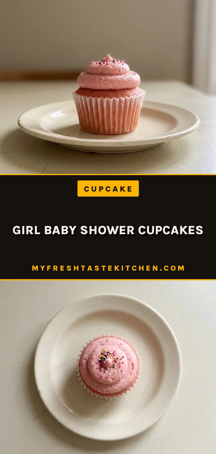 Overhead shot of six pink frosted cupcakes with white sprinkles on a white platter.