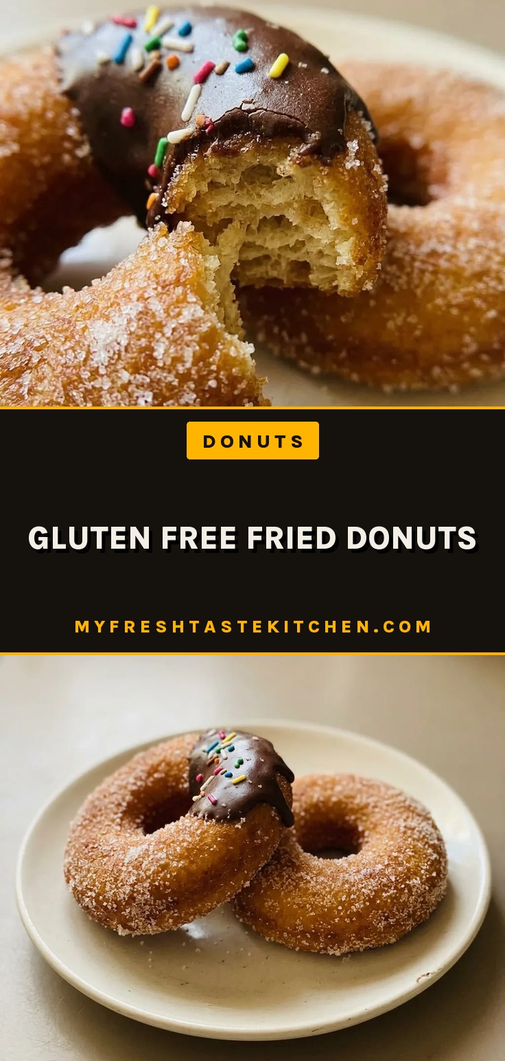 Gluten free fried donuts, golden brown and dusted with powdered sugar, arranged in a pile.