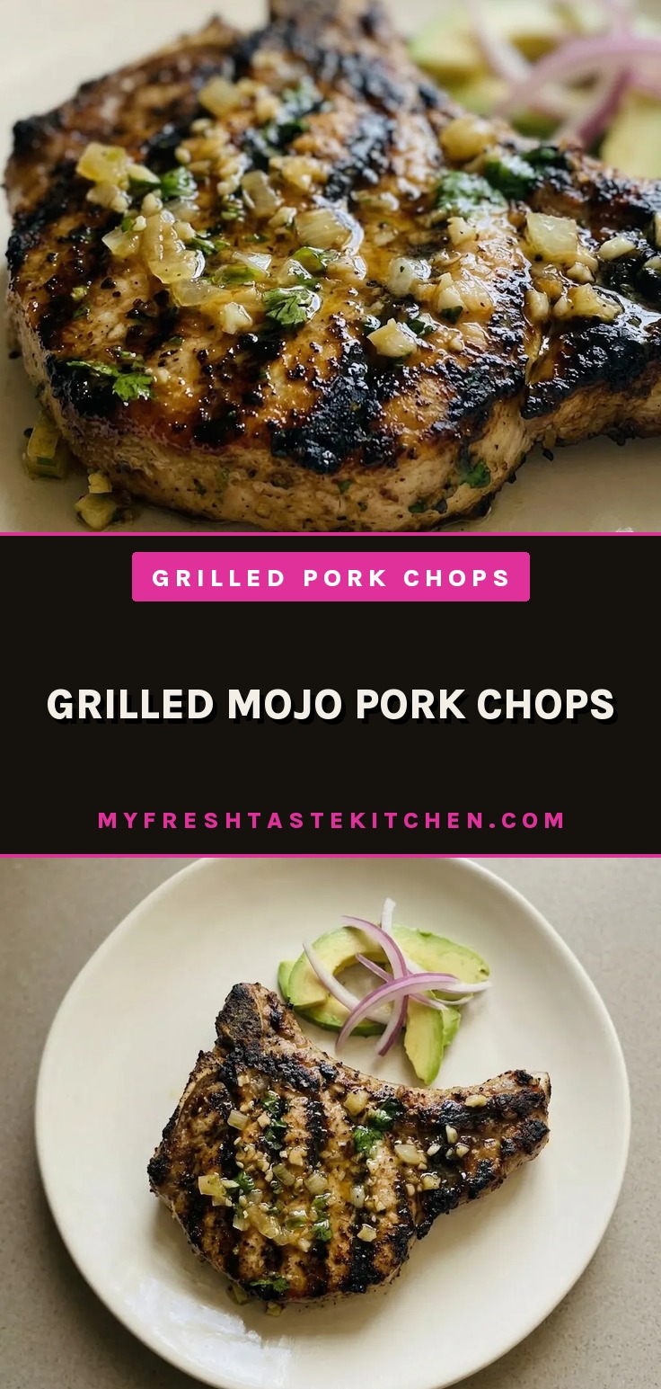 Looking down at two grilled pork chops with bitter orange marinade, scattered garlic, oregano, cumin, and cilantro.