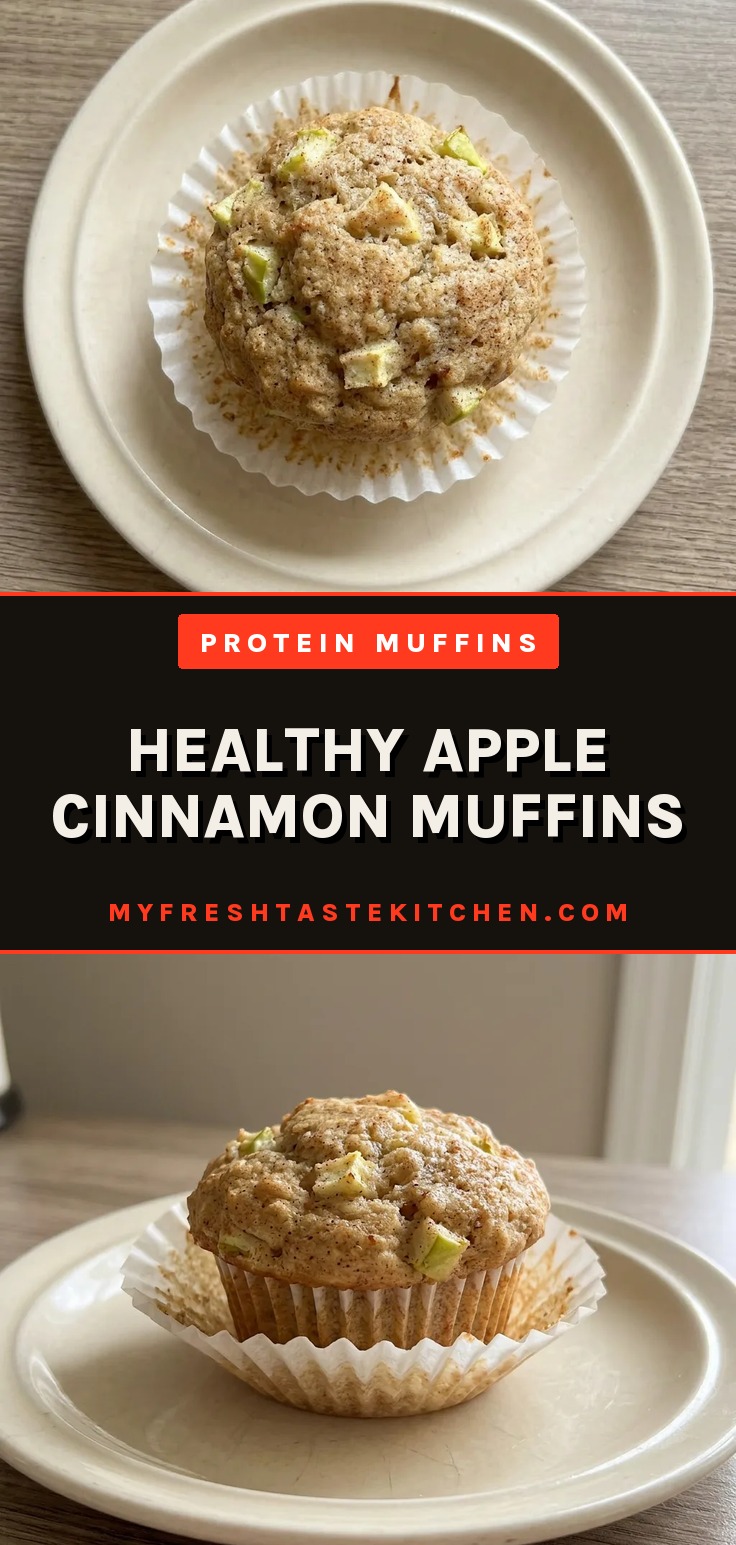 Looking down at two apple cinnamon muffins topped with walnut pieces and a drizzle of maple syrup.