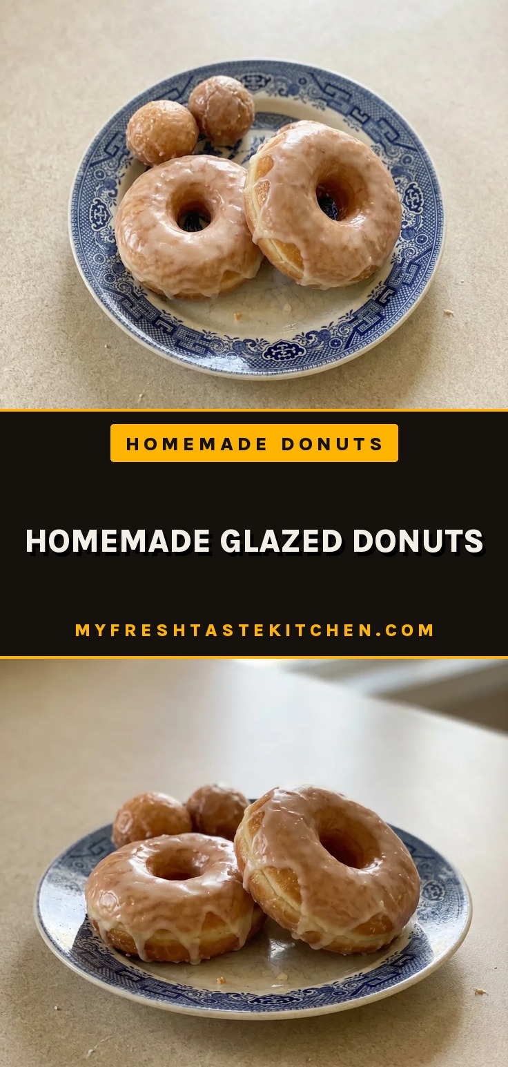 Homemade glazed donuts with a shiny vanilla glaze on a wire rack, showing their golden brown color and soft texture.