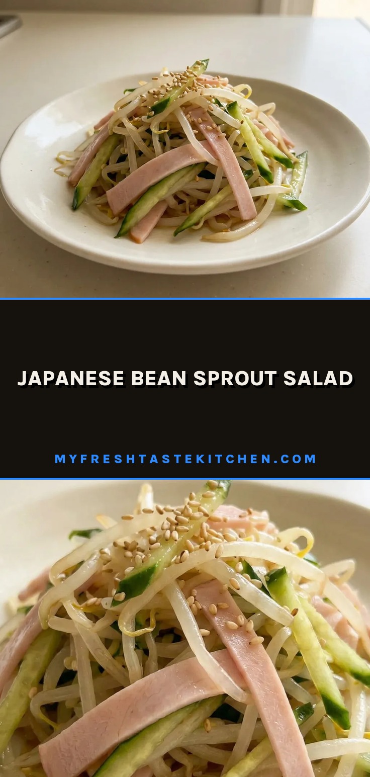Japanese bean sprout salad with bean sprouts, cucumber, ham, and sesame seeds in a bowl.