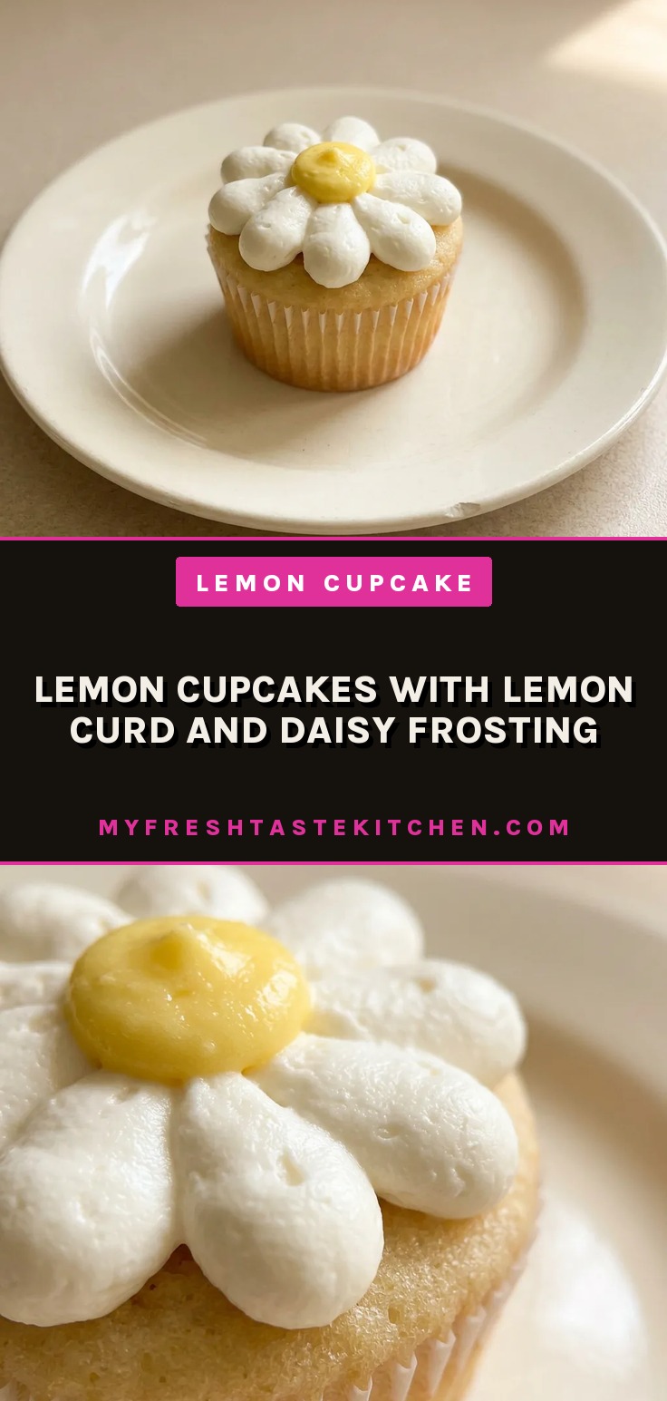 Bird's-eye view of a lemon cupcake topped with white daisy frosting and a dollop of lemon curd.