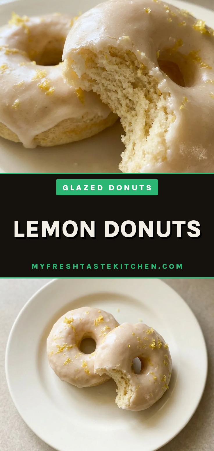 Glazed lemon cake donuts with lemon zest on a wire rack, showing a glossy lemon glaze.