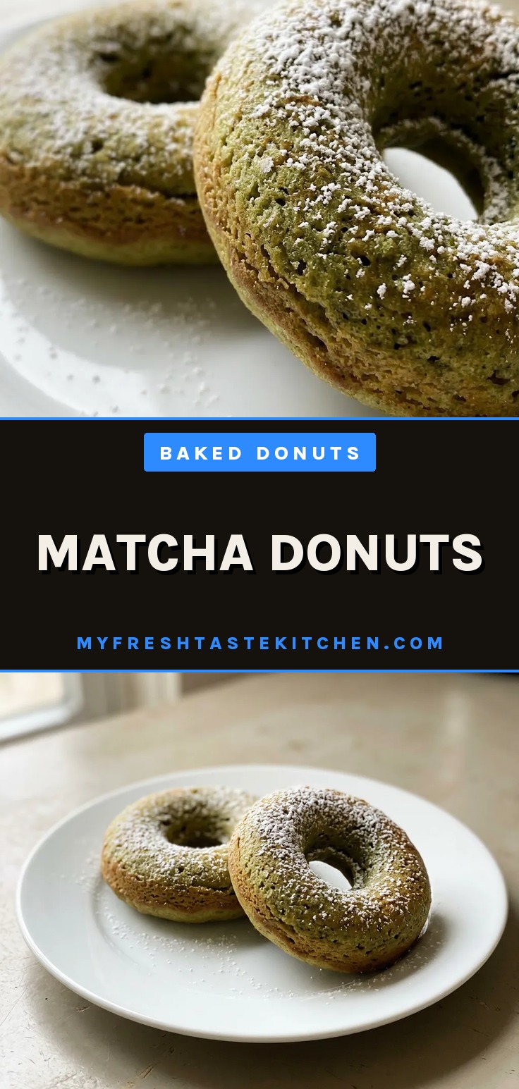Matcha donuts with a green glaze and powdered sugar on a cooling rack.