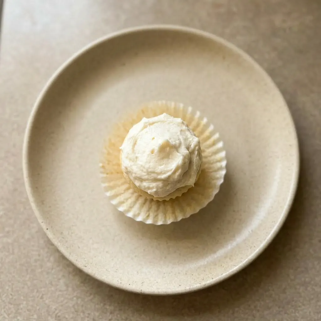 Ready to serve: mini cupcakes with buttercream and whipped cream toppings.