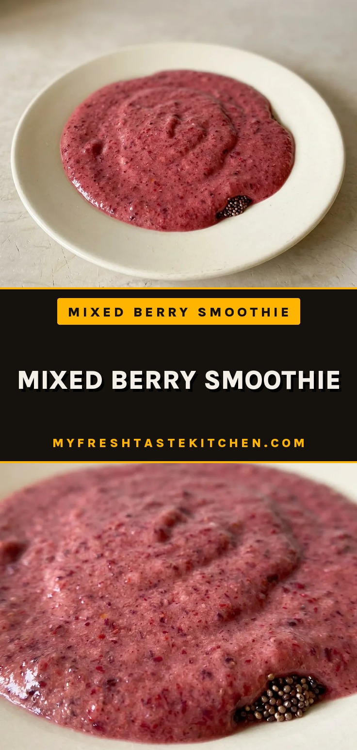 Mixed berry smoothie, a thick purple blend with frozen mixed berries, banana, and yogurt in a glass.