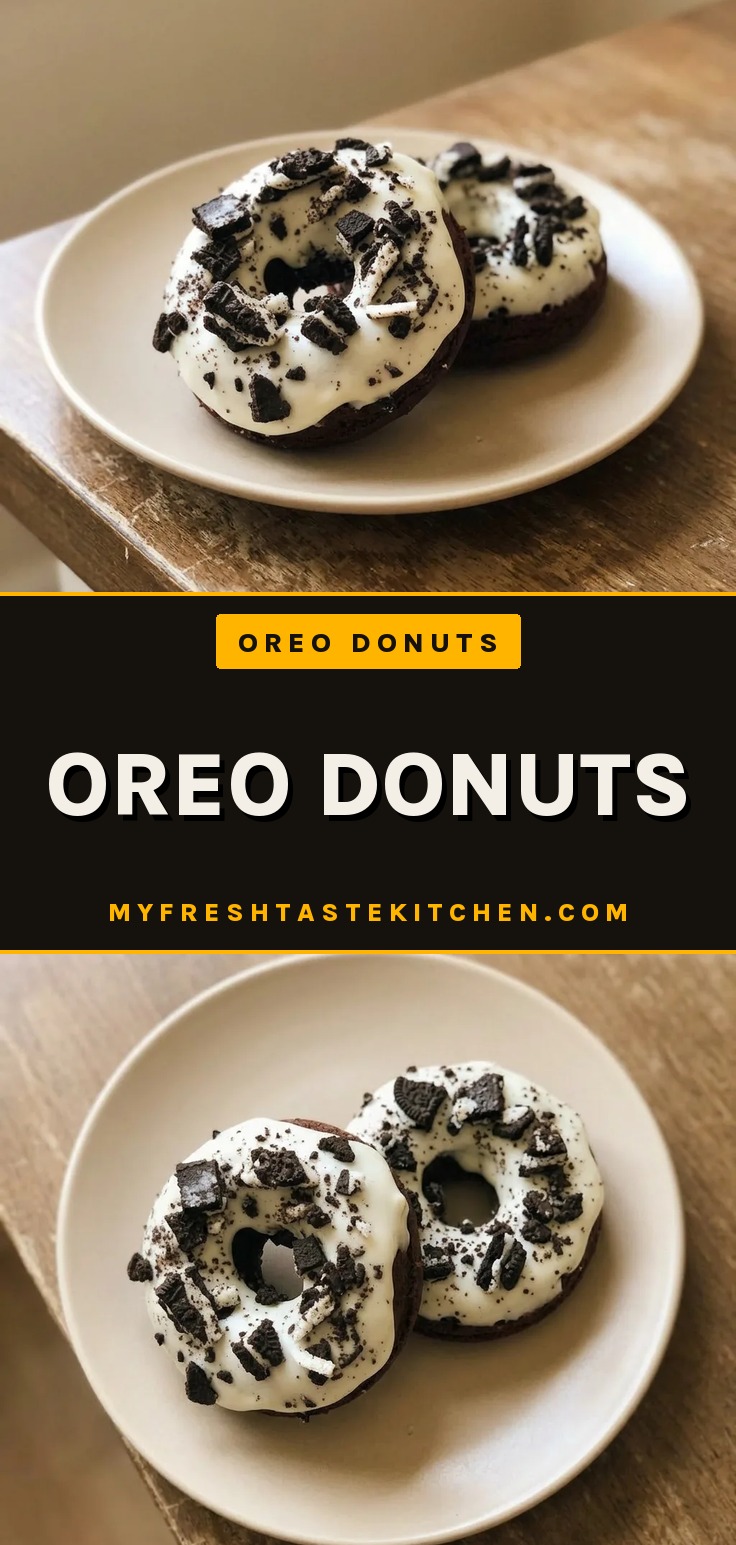 Oreo donuts topped with cream cheese frosting and crushed Oreo cookies on a cooling rack.