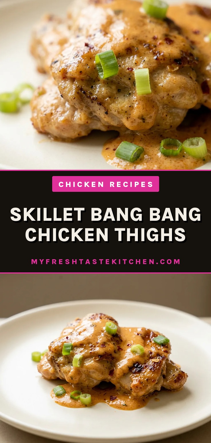 Bird's-eye view of three glazed chicken thighs drizzled with white bang bang sauce and topped with sliced green onions.