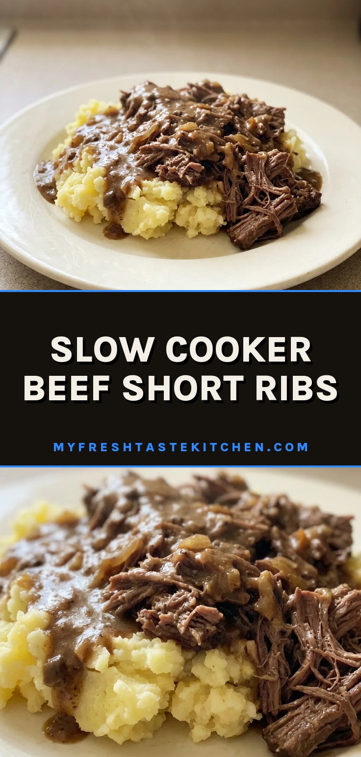 Slow cooker beef short ribs in a thick, brown gravy with bits of onion, served over mashed potatoes.