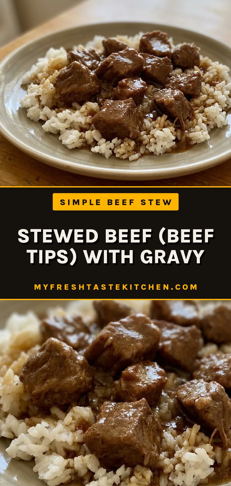 Stewed beef (beef tips) with gravy over rice, showing chunks of beef stew meat coated in thick gravy with white rice underneath.