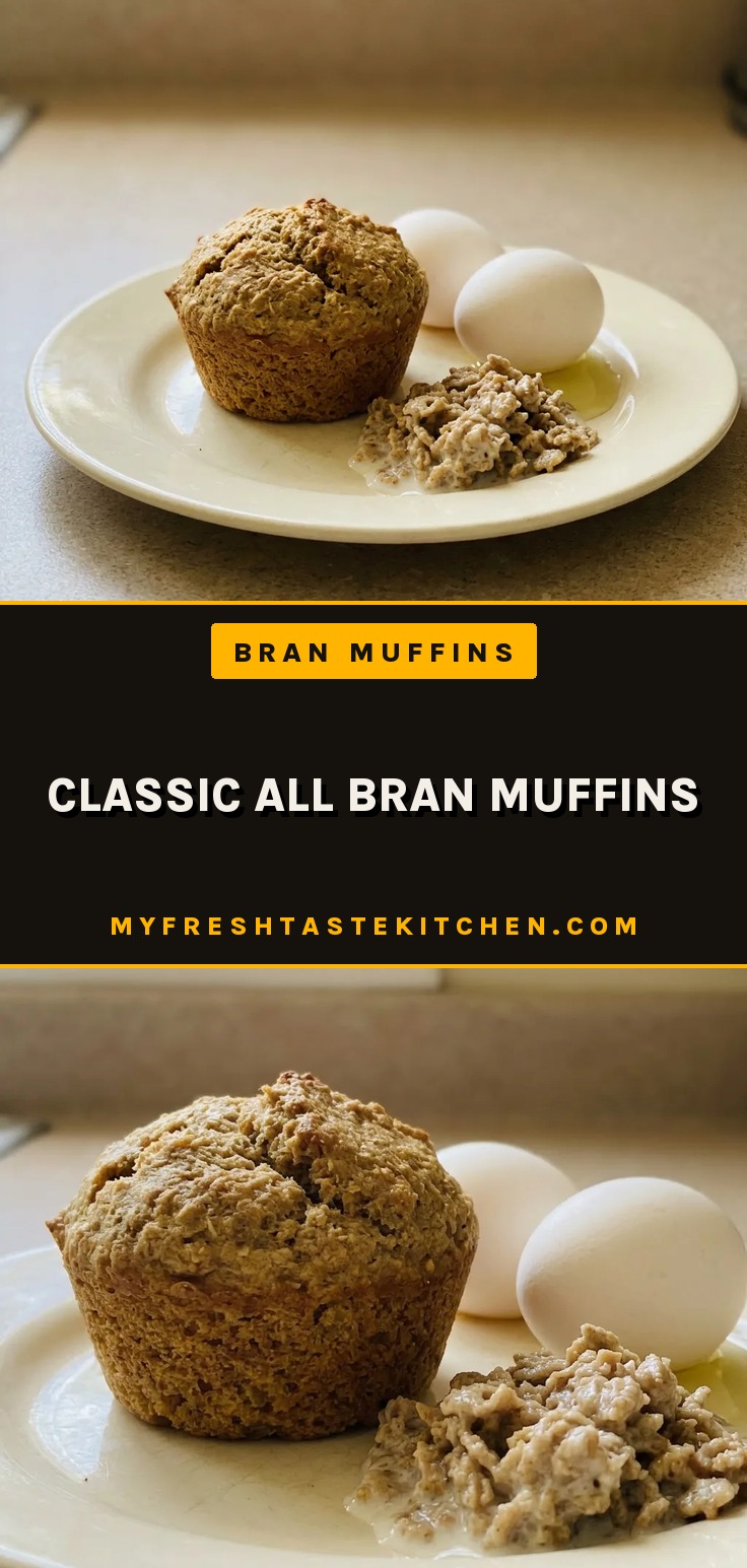 Bird's-eye view of a dark brown muffin with a domed top, visible All-Bran cereal flecks on the surface.