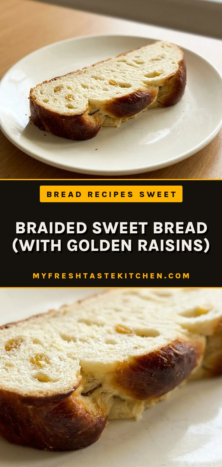 Bird's-eye view of a braided sweet bread loaf with golden raisins visible on the crust.