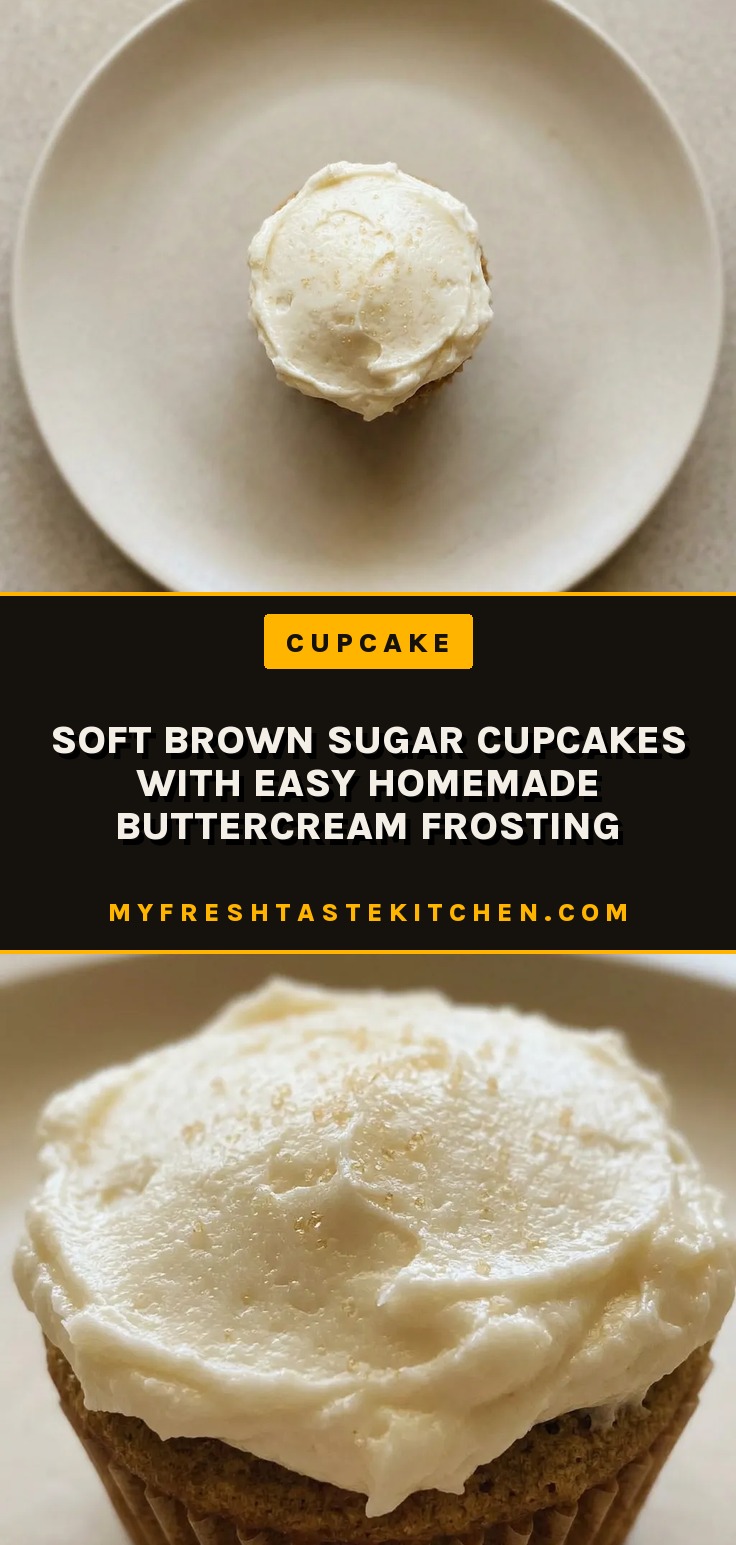 Bird's-eye view of a brown cupcake topped with swirls of white buttercream frosting.