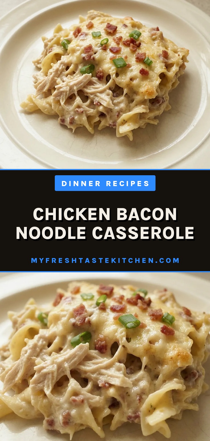 Top-down look at a casserole with egg noodles, chicken chunks, bacon bits, and melted cheddar cheese.