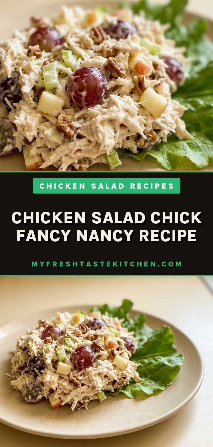 Top-down look at chicken salad topped with grapes, pecans, and celery, with visible mayonnaise coating.