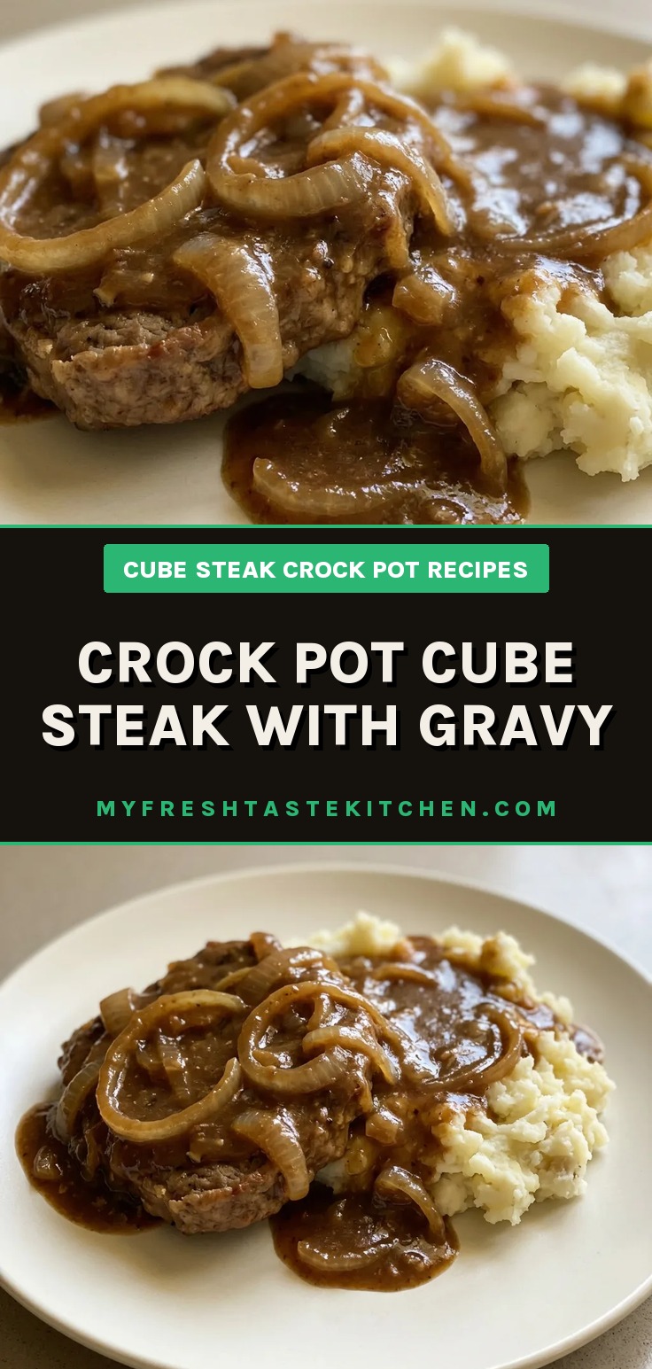 Top-down look at cube steak covered in brown gravy with visible onion pieces.