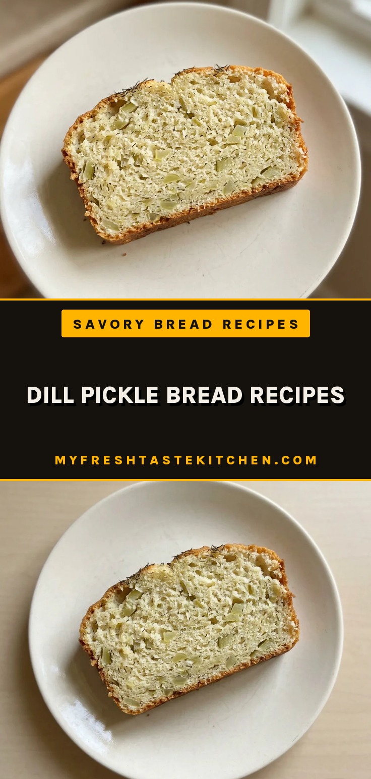 Looking down at a round loaf of bread topped with sliced dill pickles and sprinkled with dried dill weed.