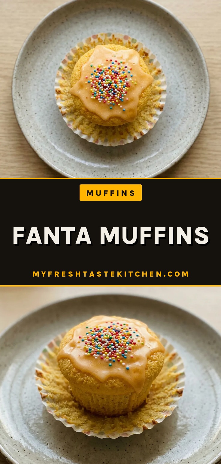 Overhead shot of three muffins with orange soda glaze and rainbow sprinkles.