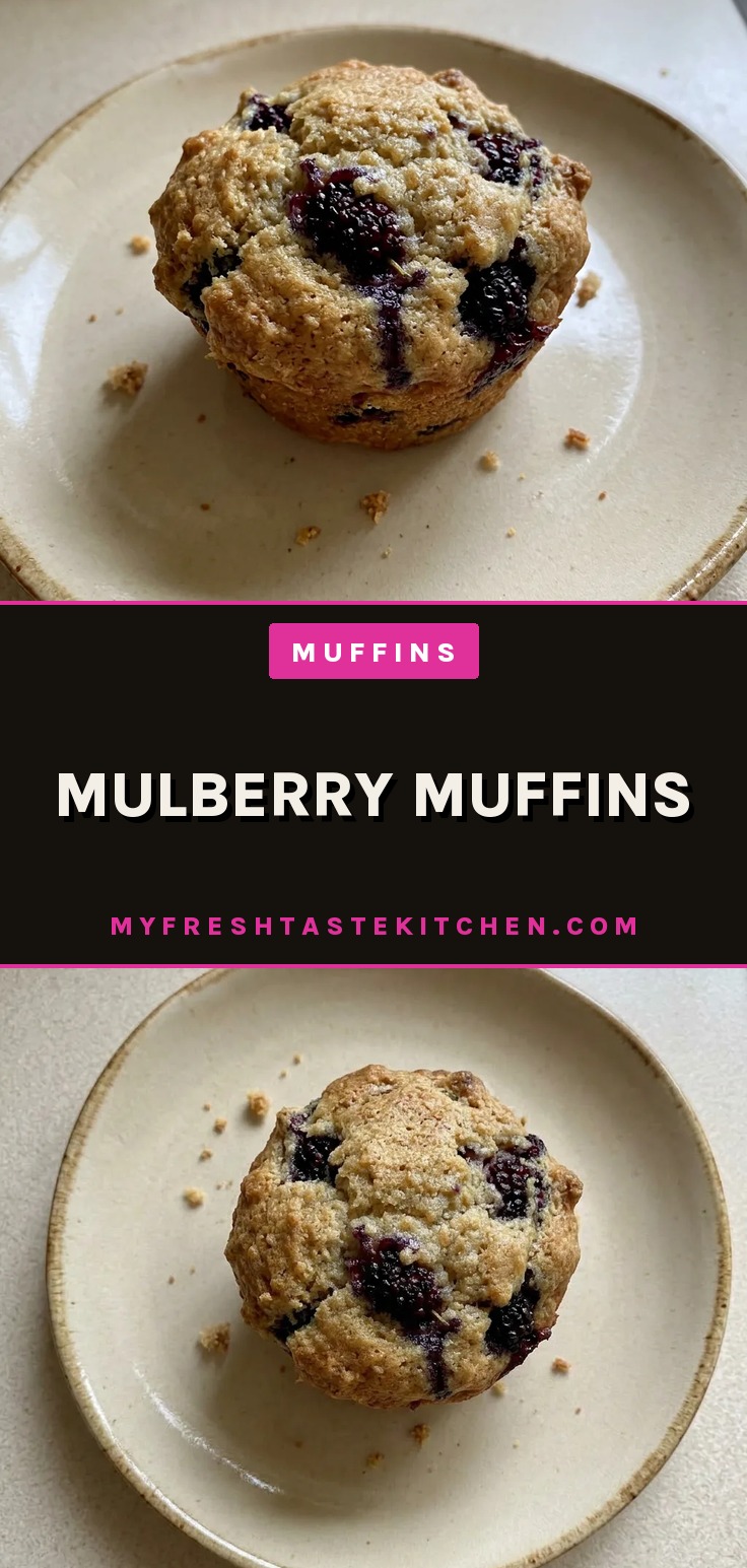 Bird's-eye view of three mulberry muffins with dark purple berries visible on top, one muffin cut in half showing purple berry swirls.