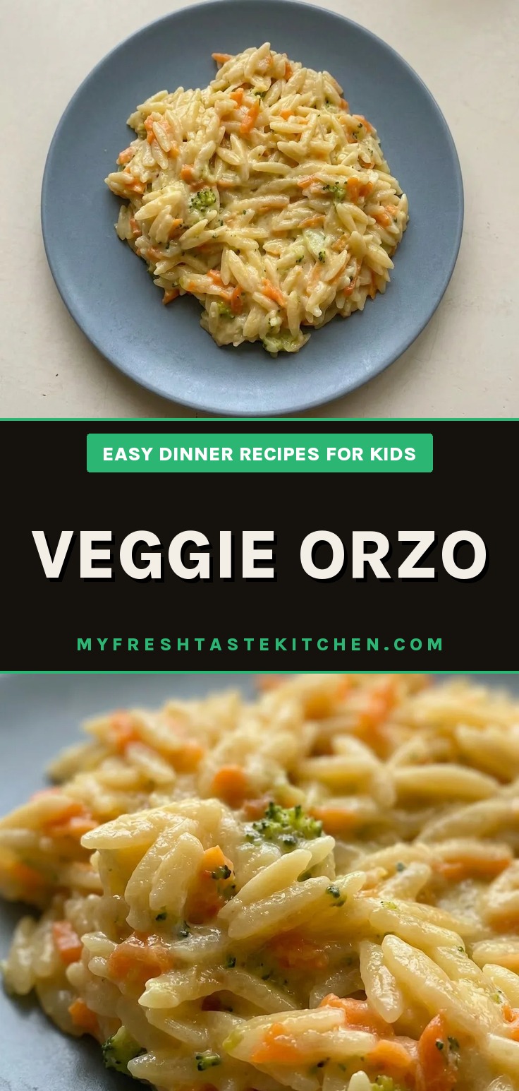 Looking down at orzo mixed with broccoli and carrots, topped with cream cheese and parmesan.