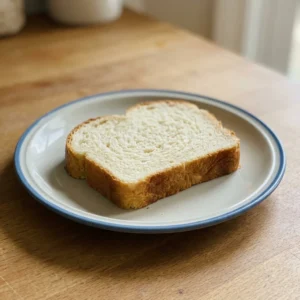 Top-down look at a round loaf with a golden crust and light scoring marks.