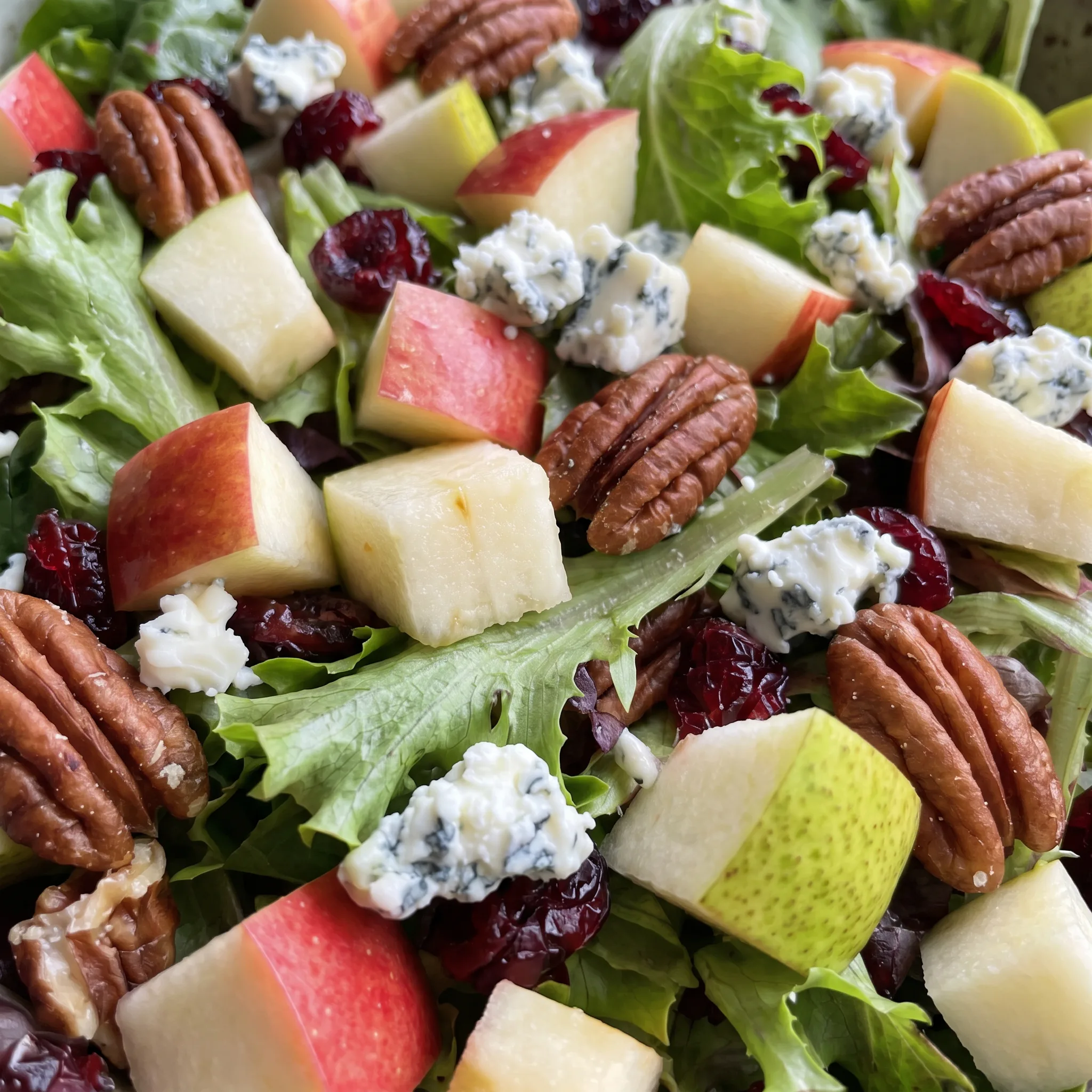Crunchy salted pecans and creamy blue cheese crumbles atop crisp greens with tart dried cranberries.