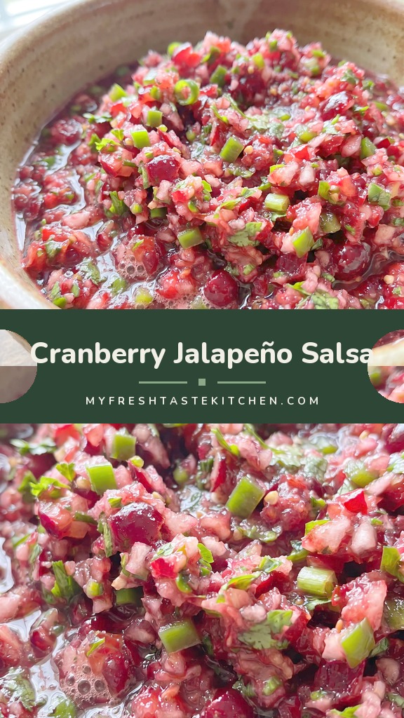 Finely minced red cranberries mixed with green jalapeño slices, cilantro leaves, and grated ginger, glossy with a light syrup.