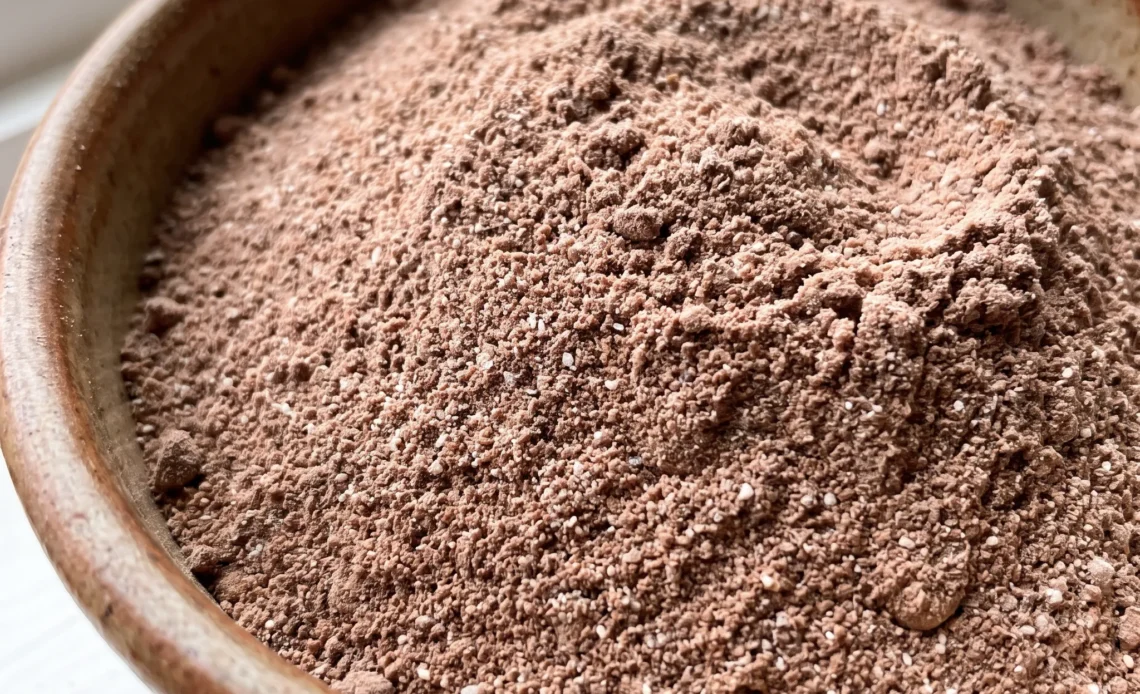 Sugar-free hot cocoa mix with powdered milk, baking cocoa, and instant chocolate pudding, dry and blended.