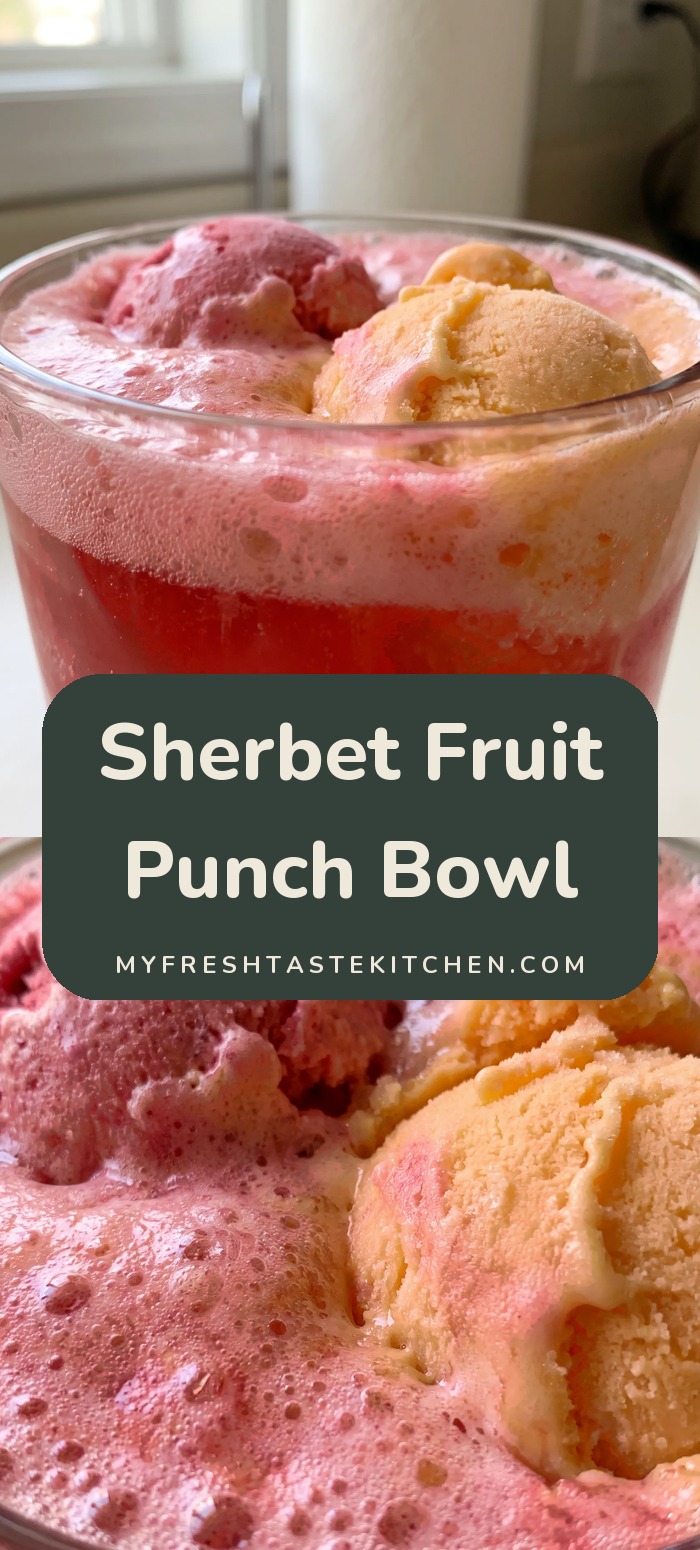 Glass of red punch with scoops of pink and orange sherbet floating in a foamy top.