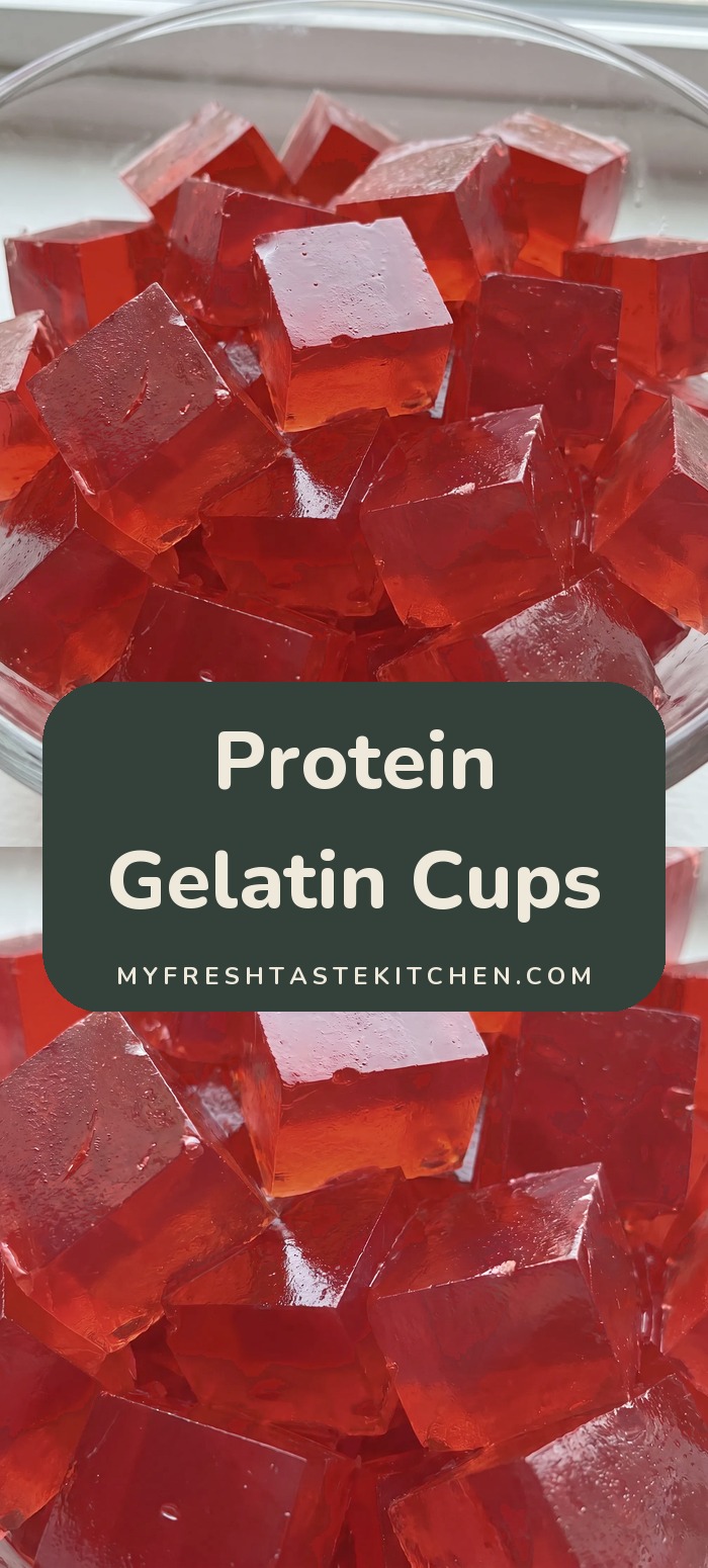 Glass bowl filled with bright red gelatin cubes.